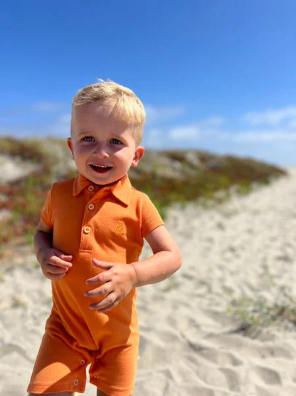 Drift Polo Romper - Tangerine Pique