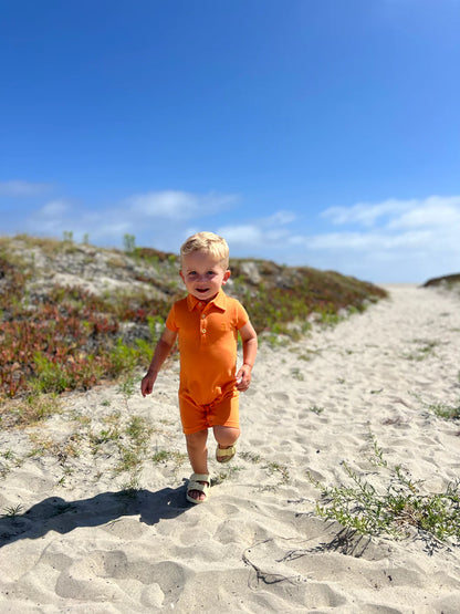 Drift Polo Romper - Tangerine Pique