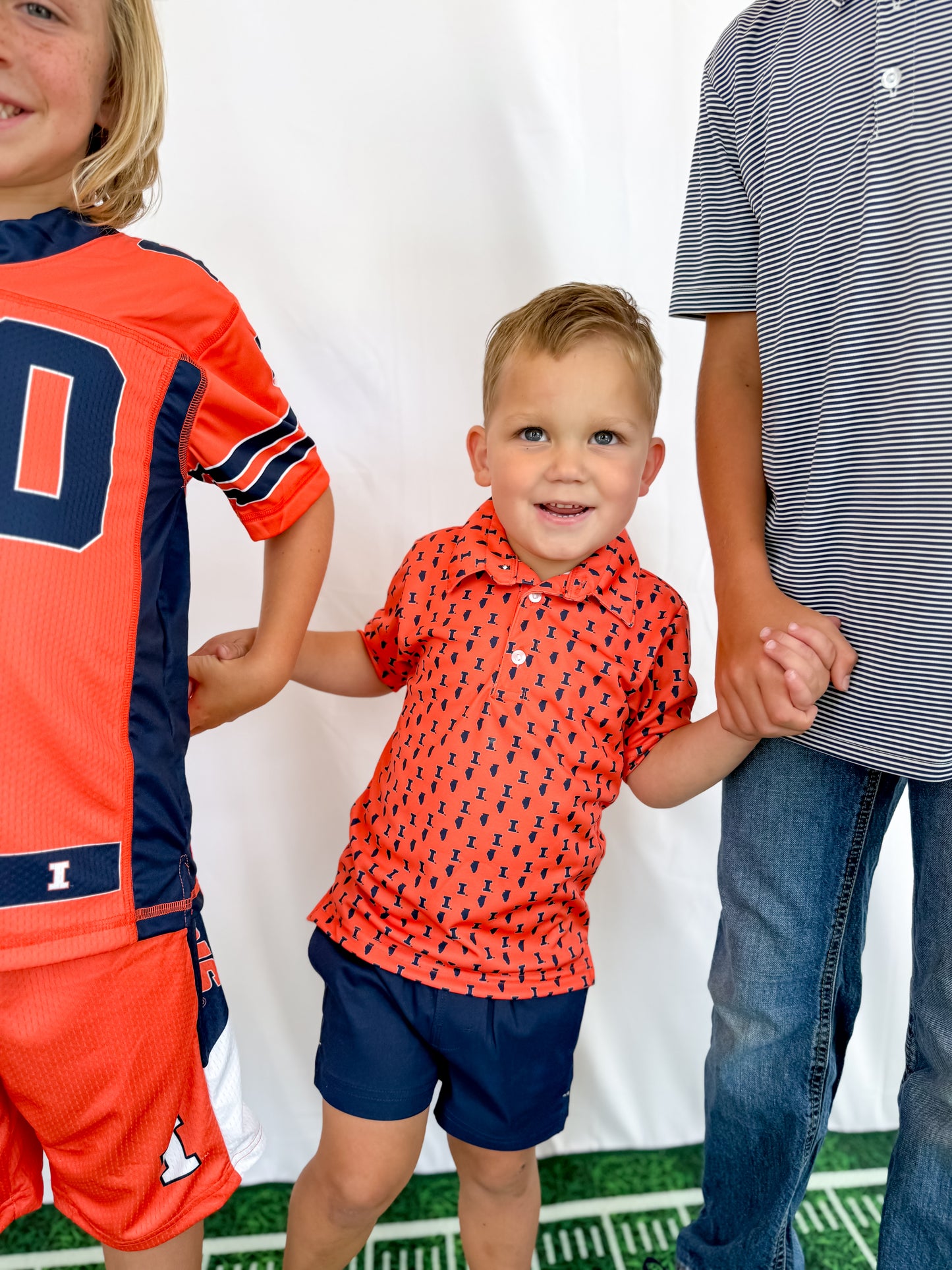 Illinois Fighting Illini All Over Logo Orange Short Sleeve Polo Shirt